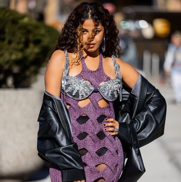 new york, new york february 11 a guest wears cut out dress, black leather jacket outside area during new york fashion week on february 11, 2023 in new york city photo by christian vieriggetty images
