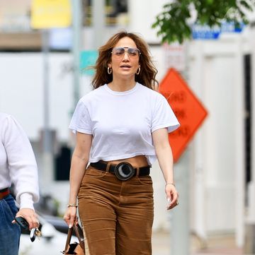 jennifer lopez wears corduroy pants and a white t shirt while shopping for furniture in west hollywood