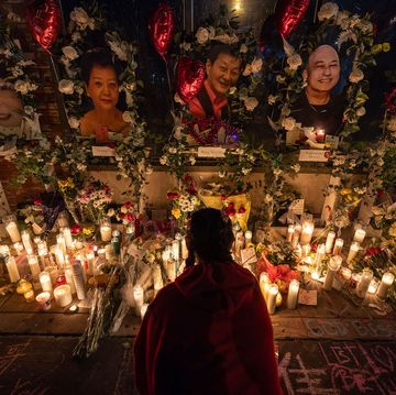 Monterey Park Mass Shooting Memorial a young woman lights incense at a vigil for those murdered during a mass shooting at star ballroom dance studio in monterey park, california